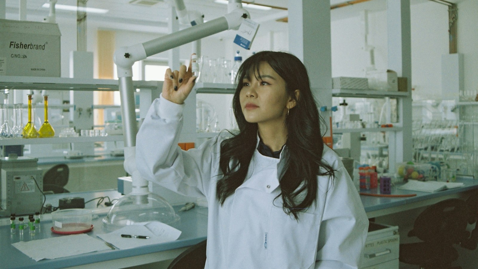 A scientist works in a bright laboratory
